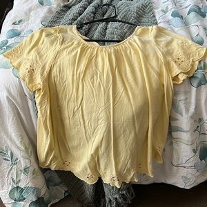 Lauren Conrad, small yellow top.